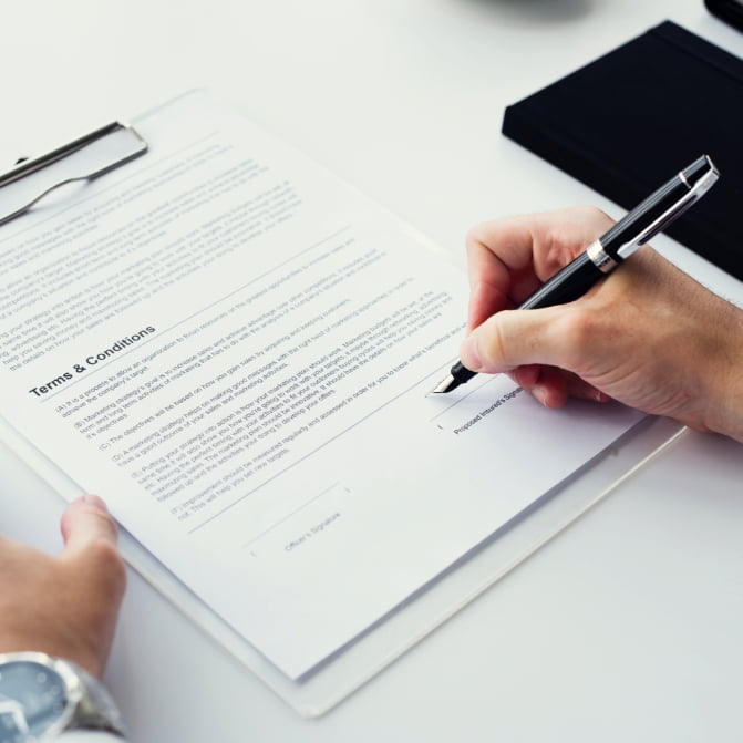 Man signing the document.